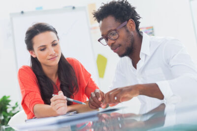 A business traveler reviewing their travel insurance policy before departing for an international trip.